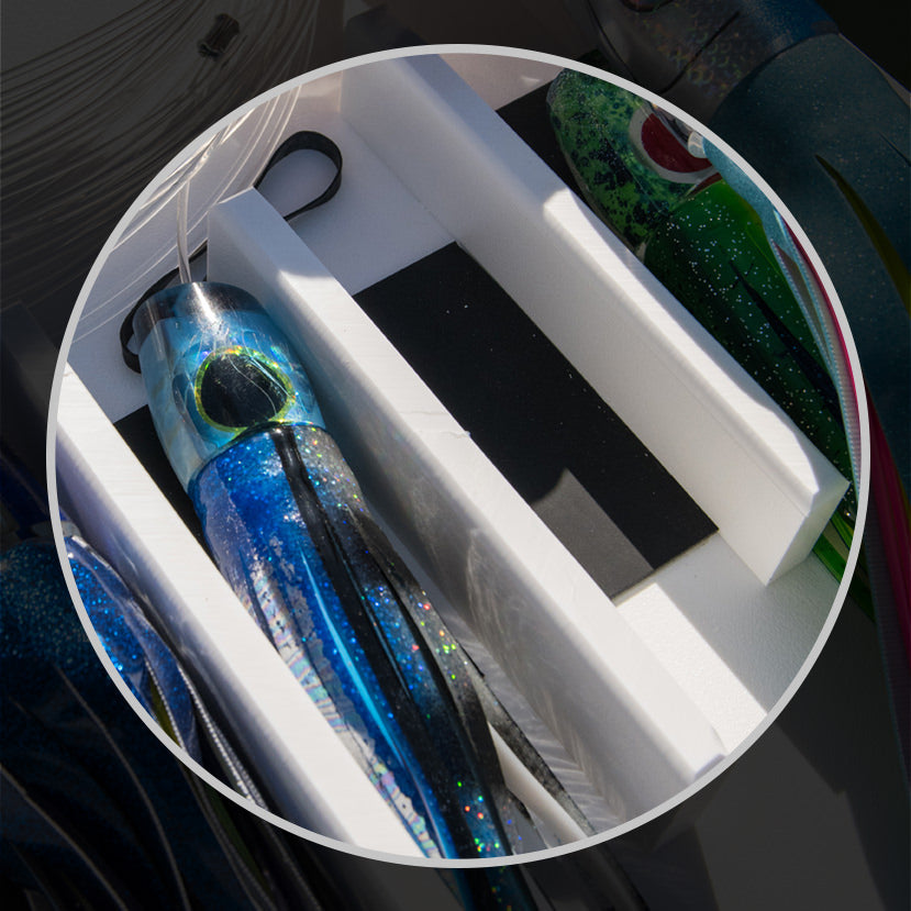 The image shows The Lure Tray's built-in lure padding to keep your lures and teasers from being damaged.